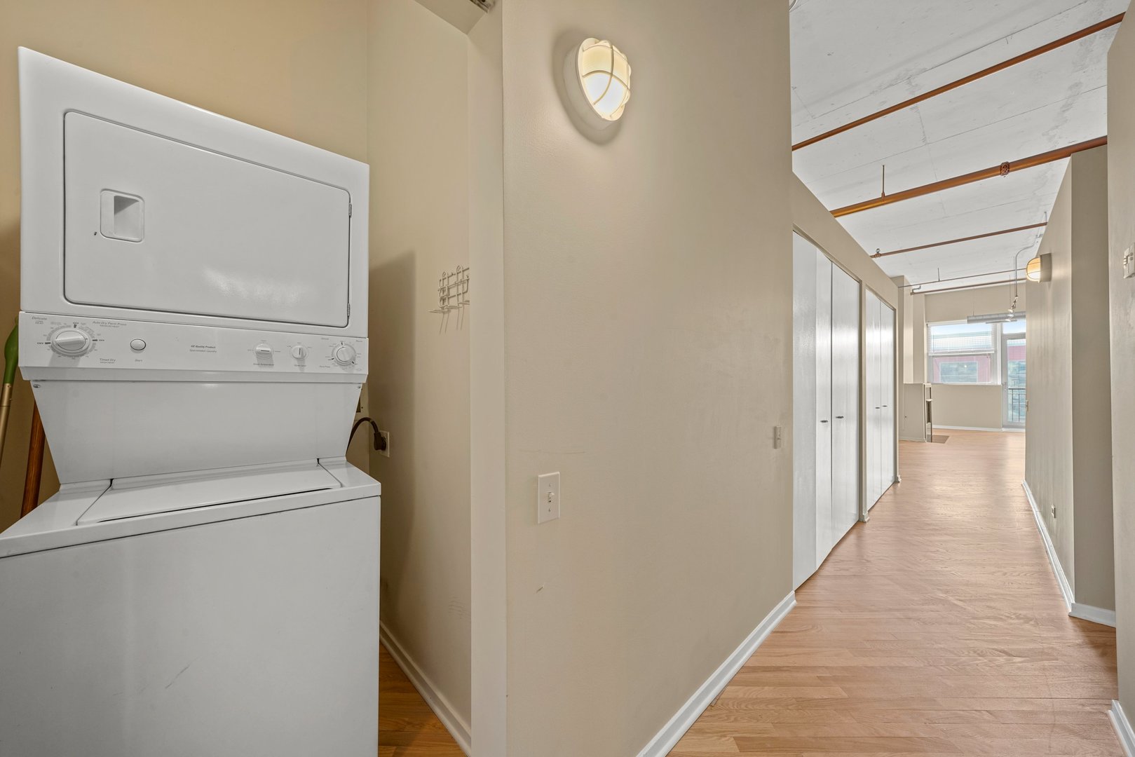 500 South Clinton Street, Unit 424 Chicago, IL 60607 - Photo 22 of 29 a view of a hallway with washer and dryer