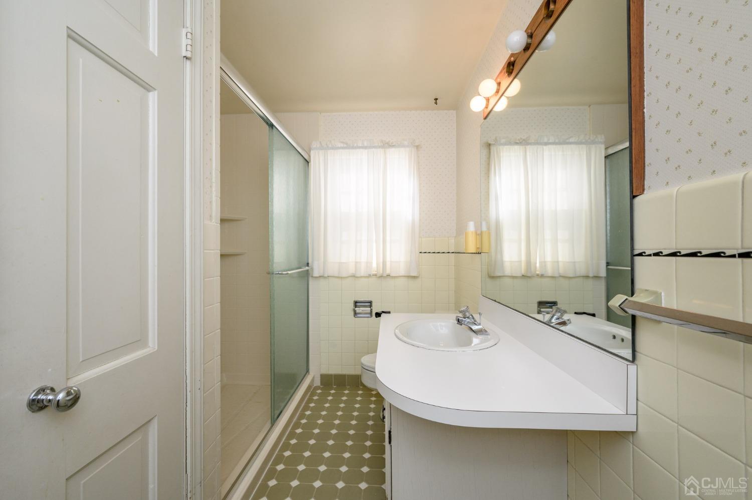 6 Far View Drive Mountainside, NJ 07092 - Photo 18 of 45 a bathroom with a sink and a mirror