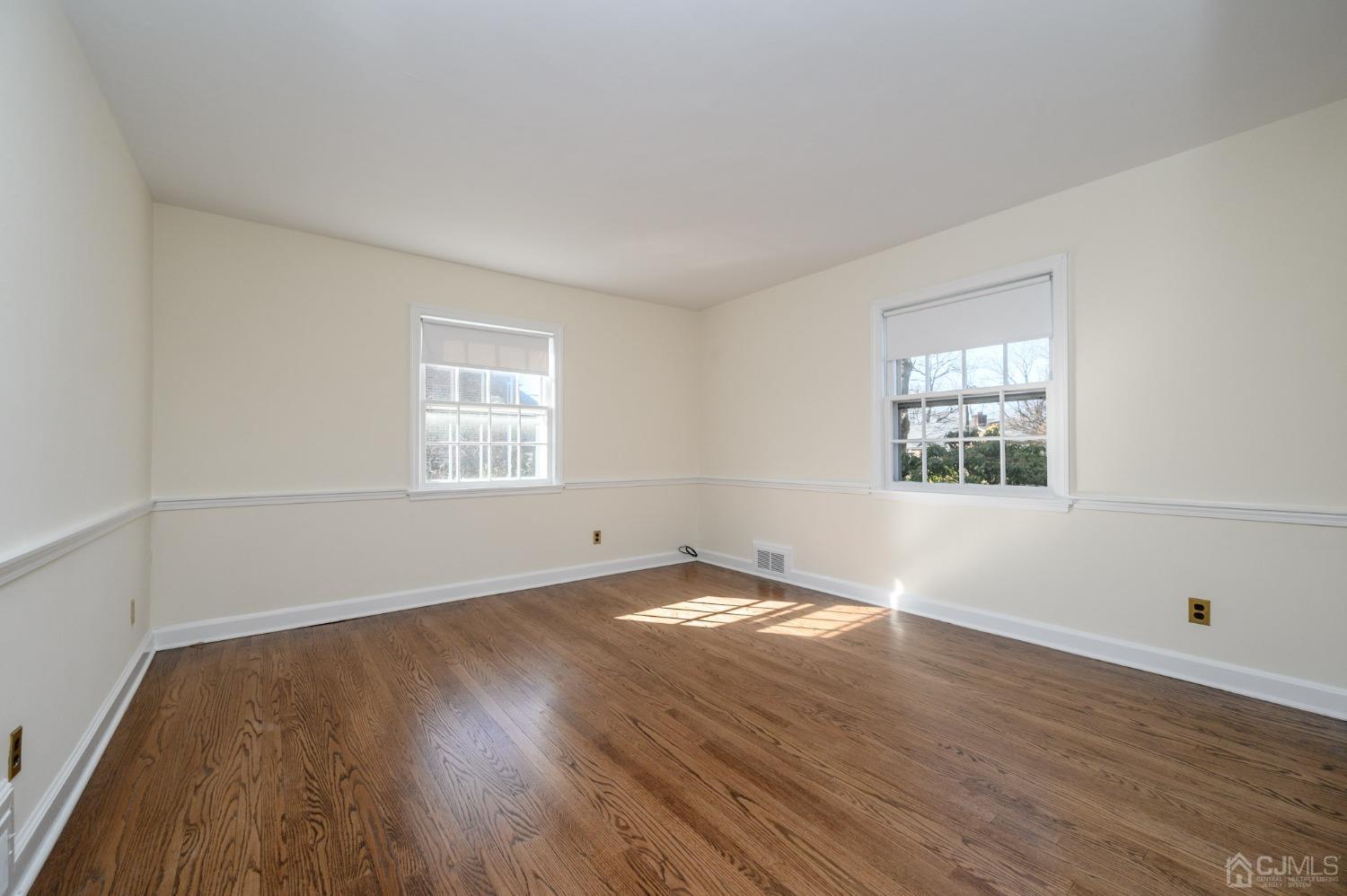 6 Far View Drive Mountainside, NJ 07092 - Photo 19 of 45 an empty room with wooden floor and windows
