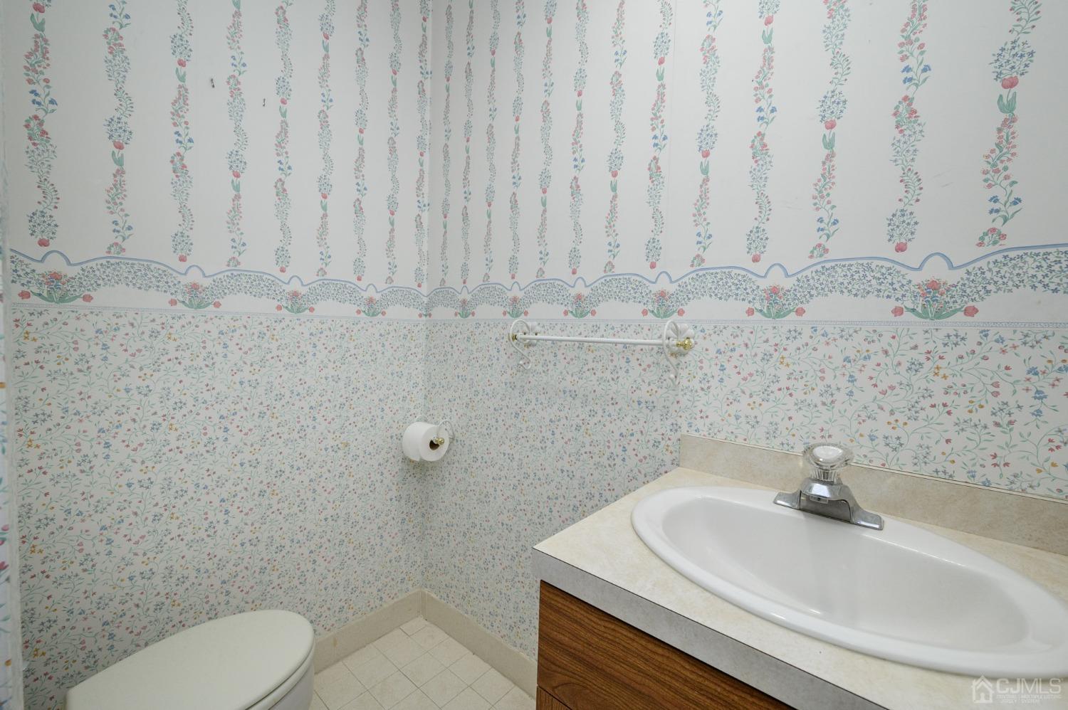 6 Far View Drive Mountainside, NJ 07092 - Photo 21 of 45 a bathroom with a sink a toilet and a mirror