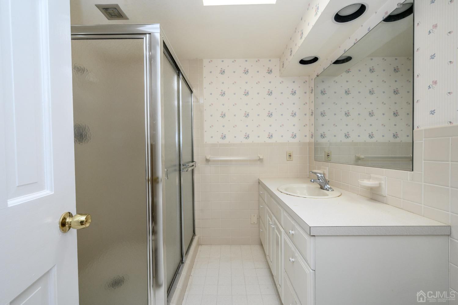 6 Far View Drive Mountainside, NJ 07092 - Photo 25 of 45 a bathroom with a sink a toilet and shower