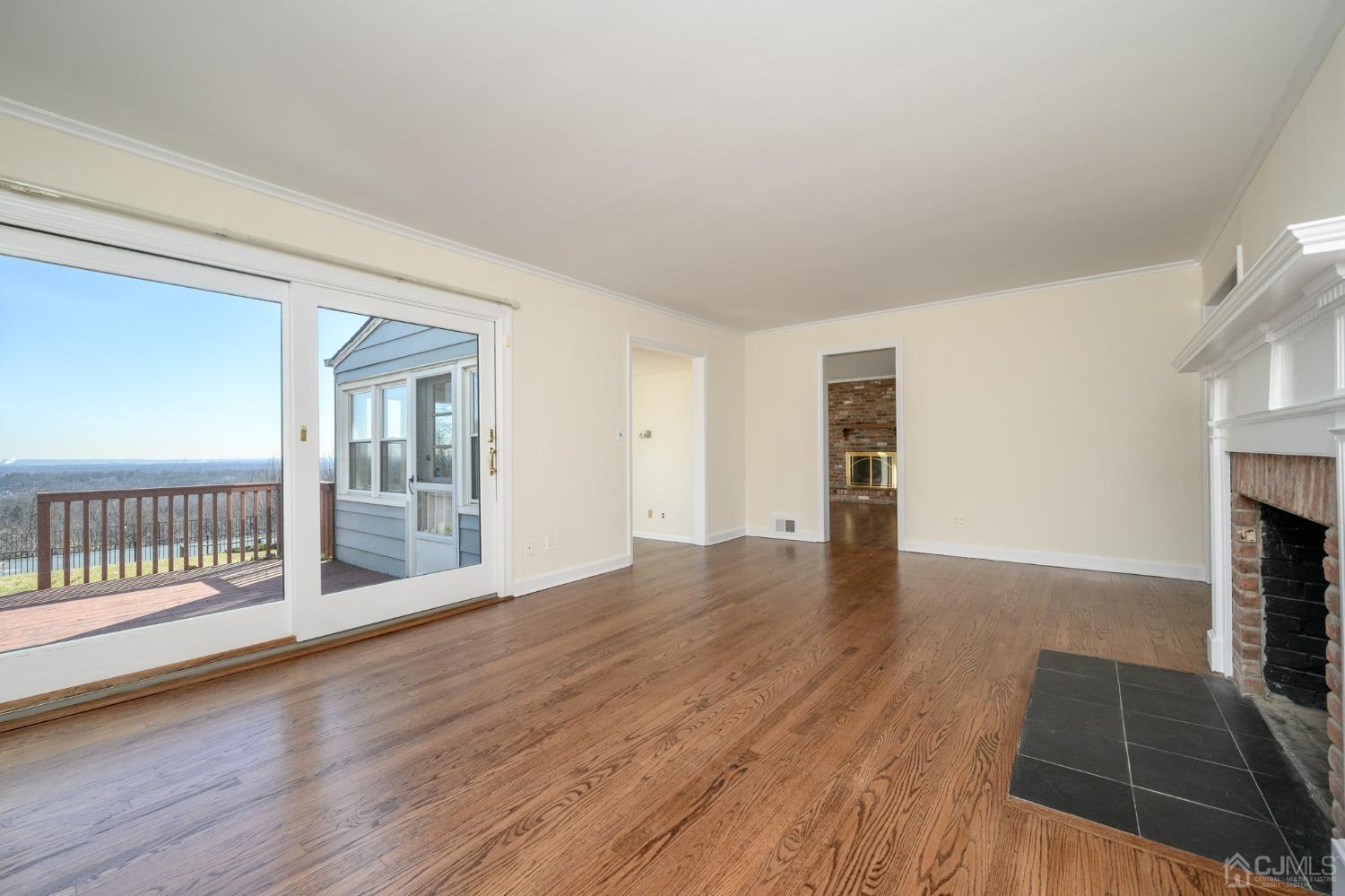 6 Far View Drive Mountainside, NJ 07092 - Photo 6 of 45 wooden floor in an empty room with a fireplace