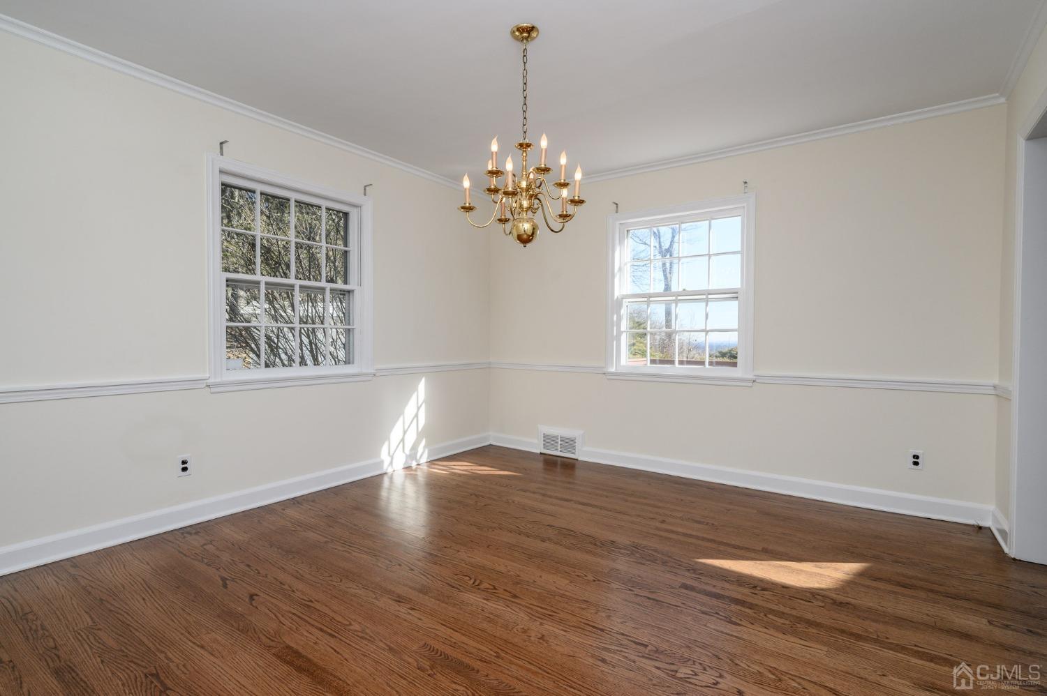 6 Far View Drive Mountainside, NJ 07092 - Photo 9 of 45 a view of an empty room with wooden floor and a window