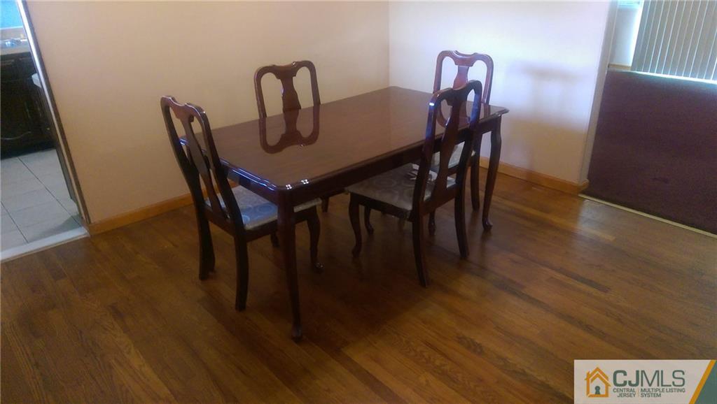 4 Yale Road Old Bridge, NJ 08859 - Photo 3 of 17 a view of a dining room with furniture and wooden floor