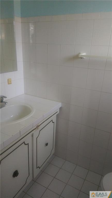 4 Yale Road Old Bridge, NJ 08859 - Photo 10 of 17 a bathroom with a sink and cabinets