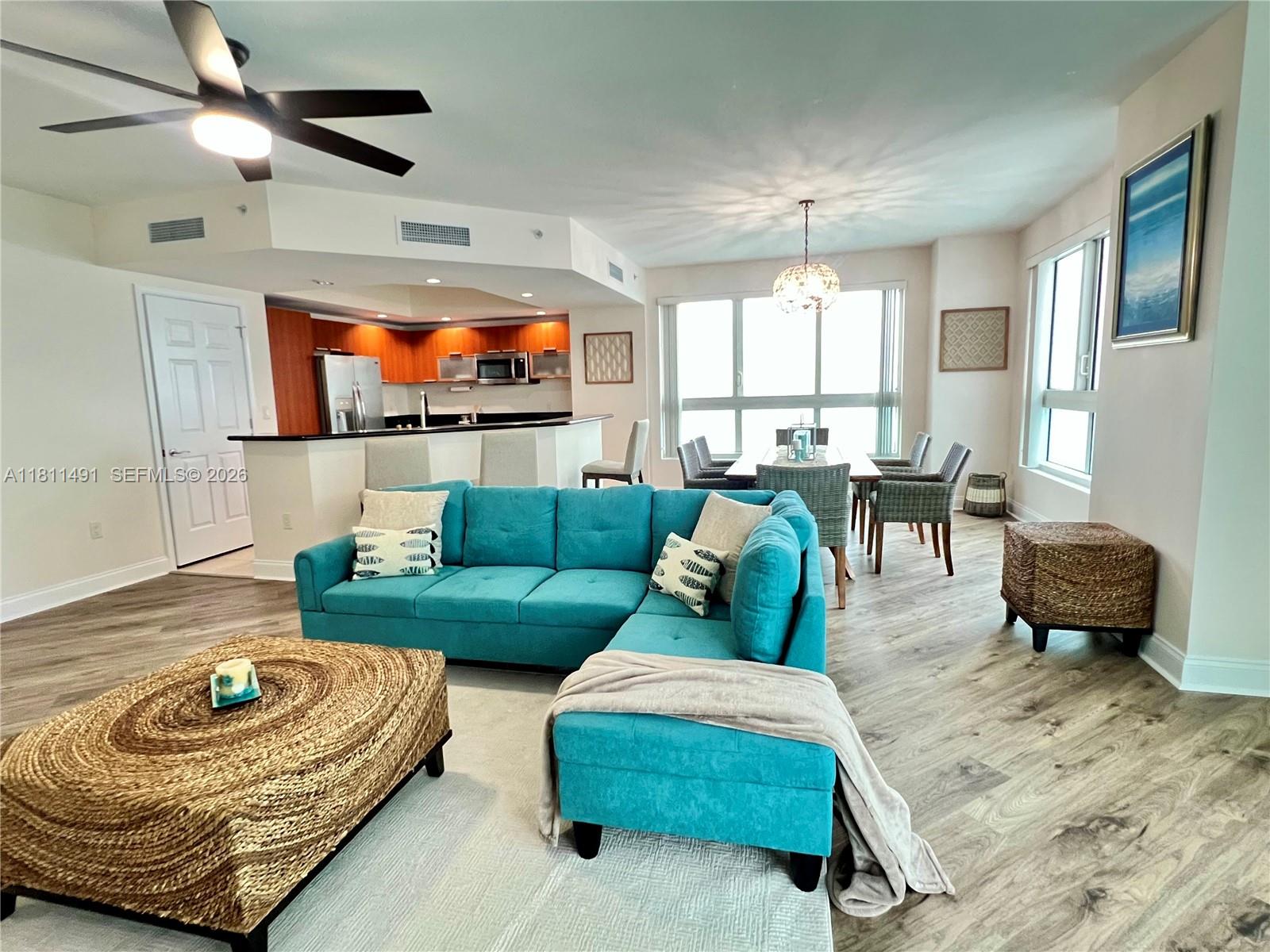 231 Riverside Drive, Unit 1210 Daytona Beach, FL 32117 - Photo 1 of 70 a living room with furniture and a large window