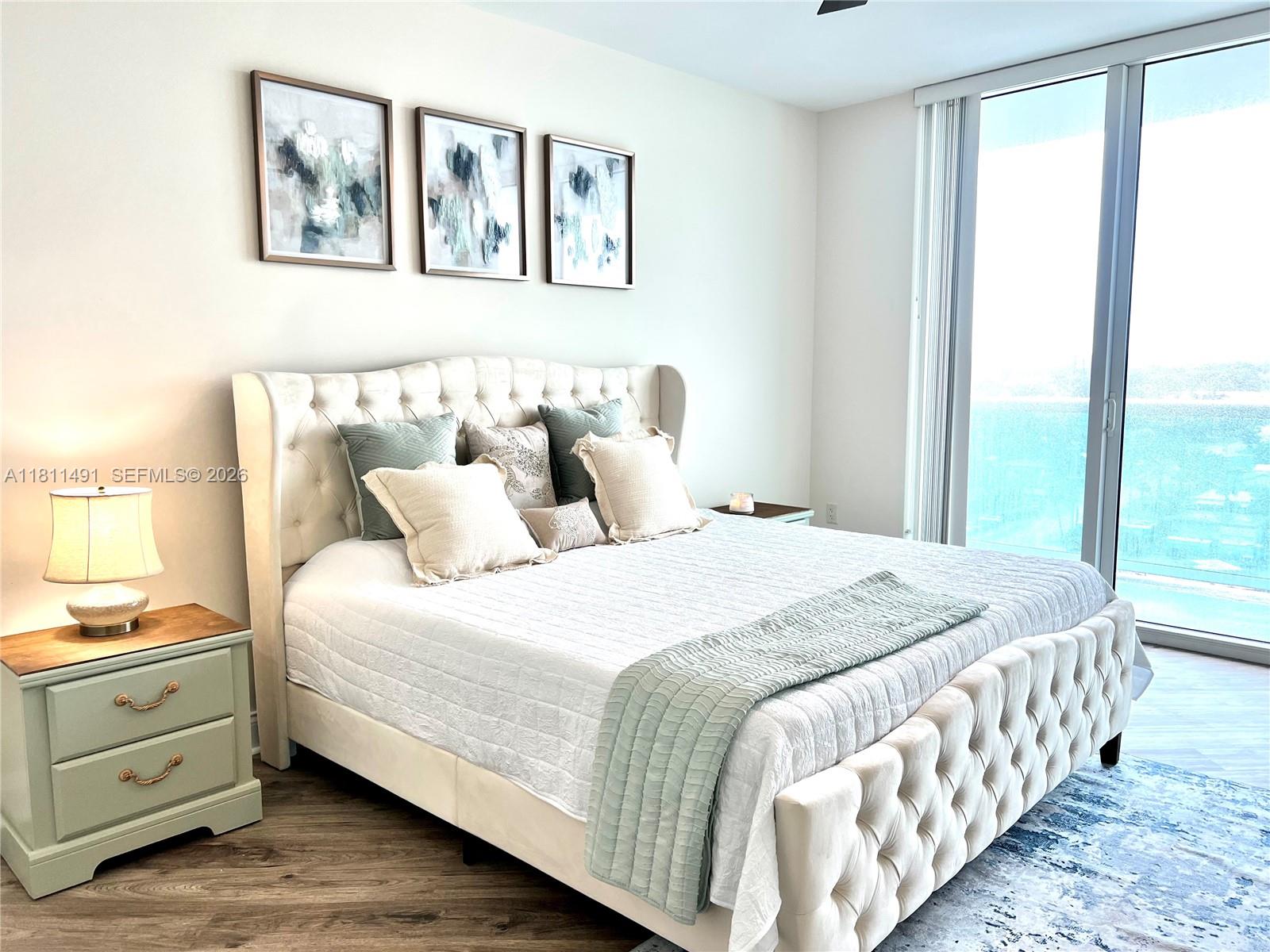 231 Riverside Drive, Unit 1210 Daytona Beach, FL 32117 - Photo 13 of 70 a bedroom with a bed and a window