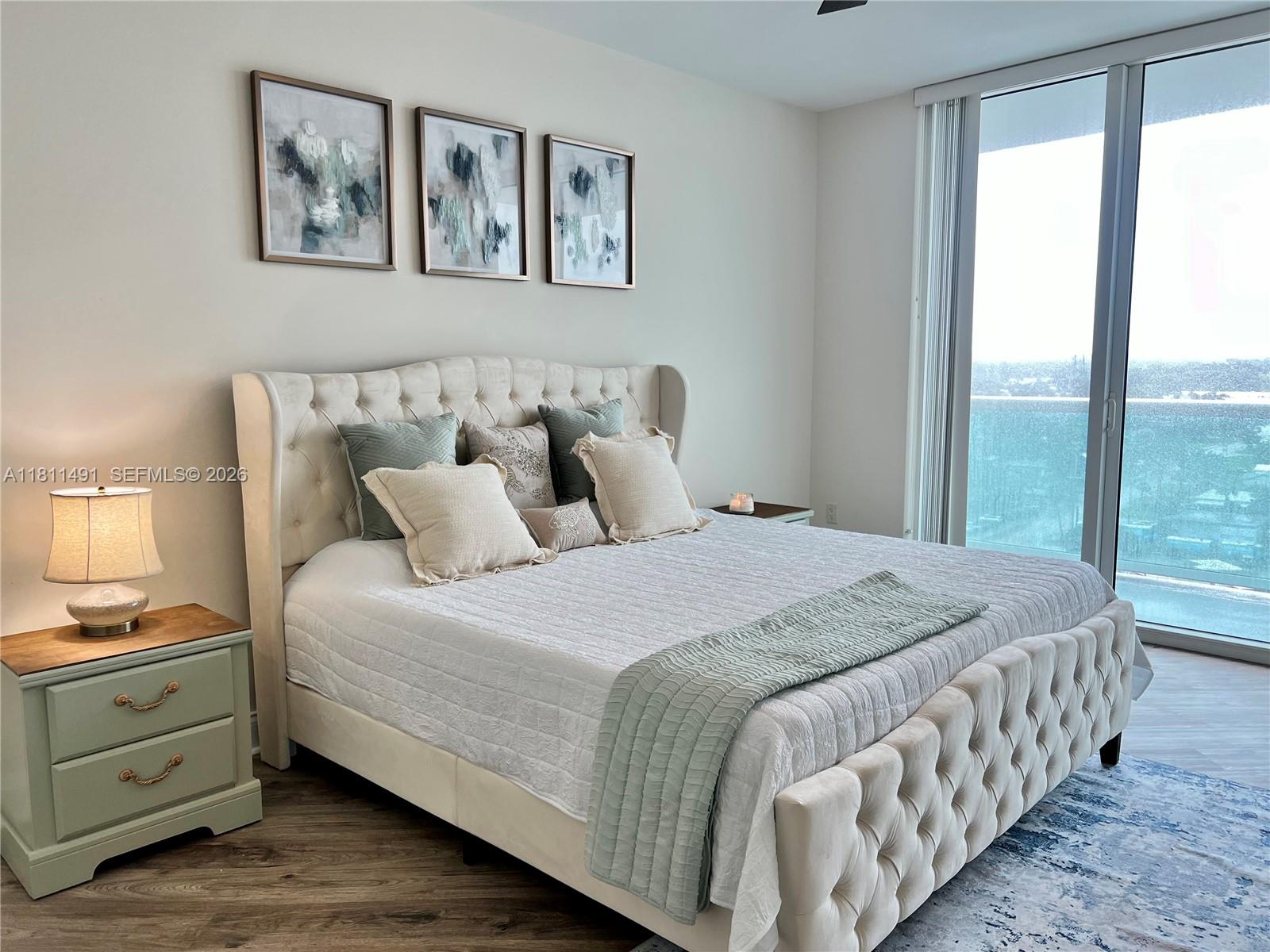 231 Riverside Drive, Unit 1210 Daytona Beach, FL 32117 - Photo 19 of 70 a bedroom with a large bed and a window