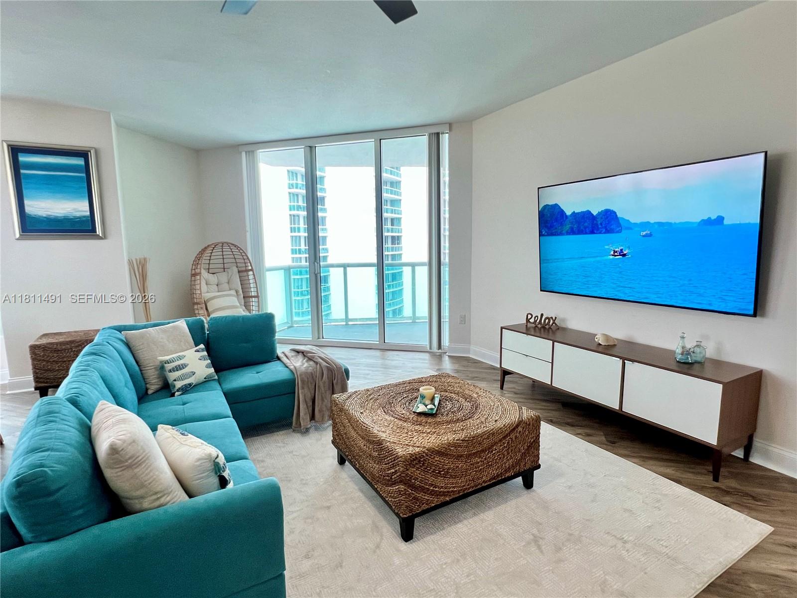 231 Riverside Drive, Unit 1210 Daytona Beach, FL 32117 - Photo 2 of 70 a living room with furniture and a couch