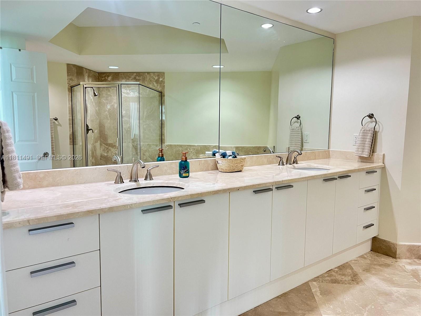 231 Riverside Drive, Unit 1210 Daytona Beach, FL 32117 - Photo 21 of 70 a bathroom with a sink and a mirror