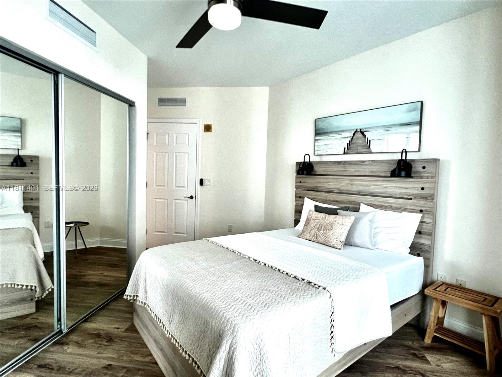 231 Riverside Drive, Unit 1210 Daytona Beach, FL 32117 - Photo 24 of 70 a bedroom with a bed and a dresser