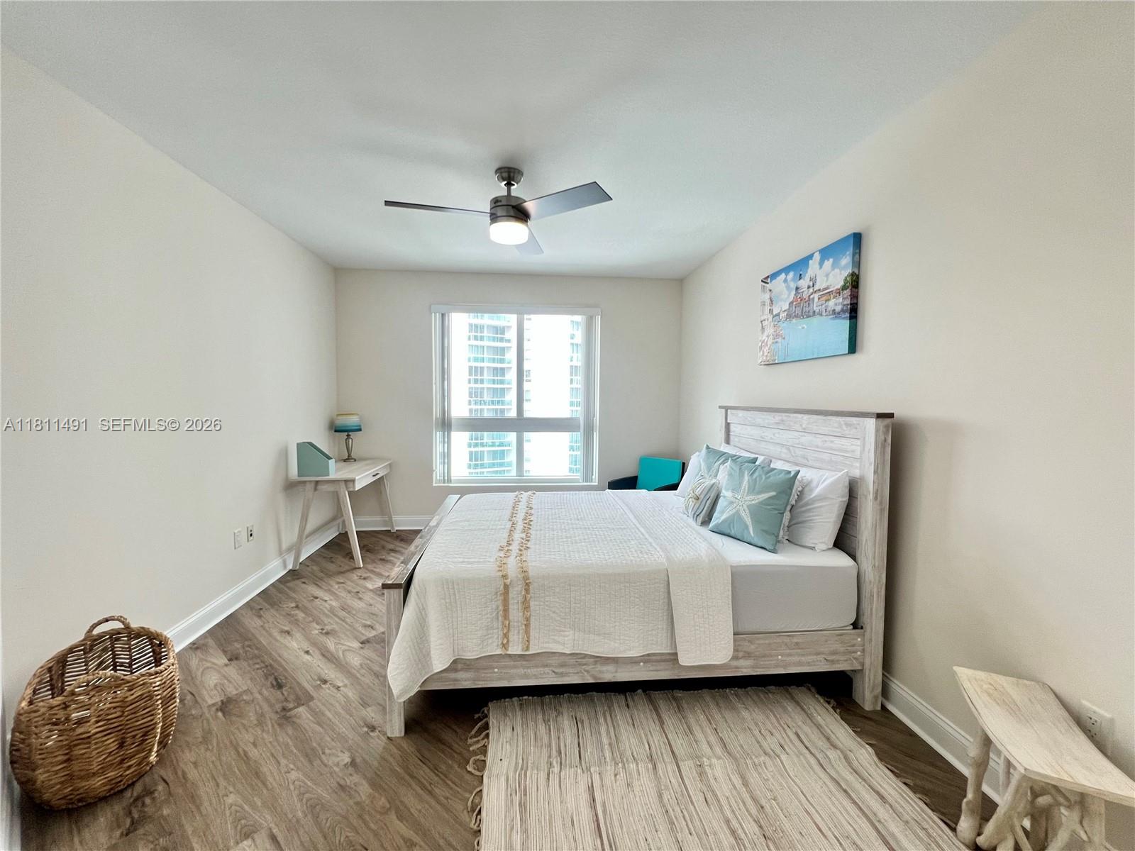231 Riverside Drive, Unit 1210 Daytona Beach, FL 32117 - Photo 28 of 70 a bedroom with a bed and a window