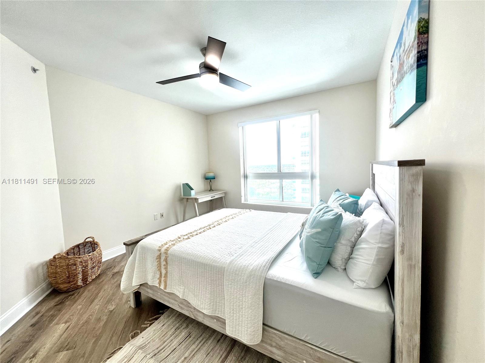 231 Riverside Drive, Unit 1210 Daytona Beach, FL 32117 - Photo 30 of 70 a bedroom with a bed and window