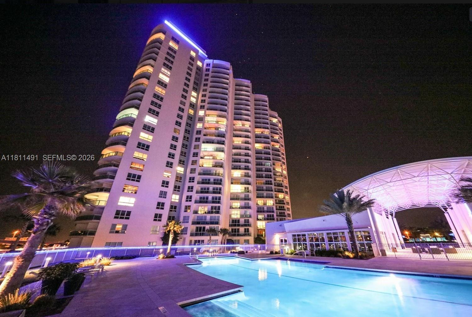231 Riverside Drive, Unit 1210 Daytona Beach, FL 32117 - Photo 37 of 70 a view of tall building with large windows