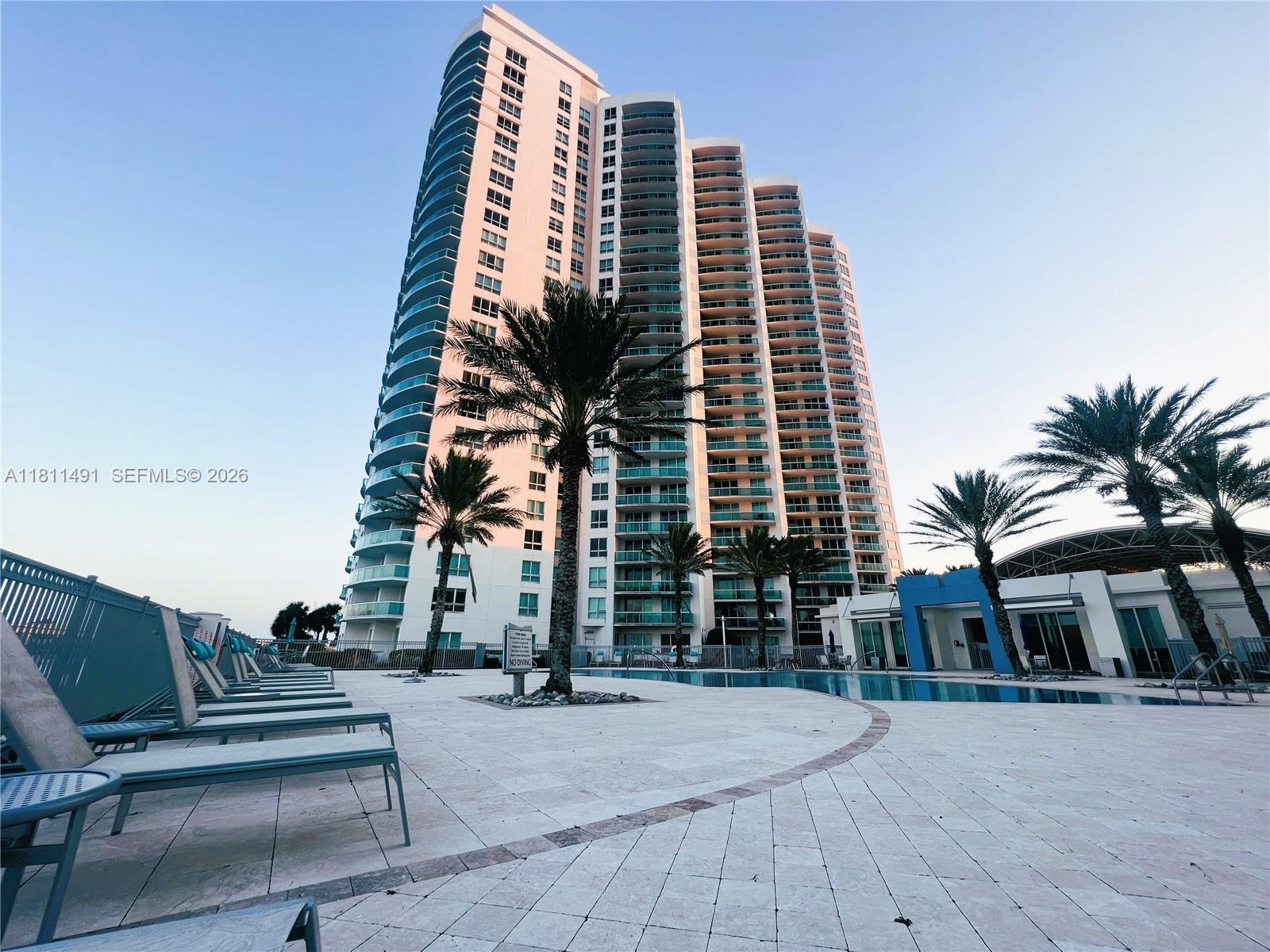231 Riverside Drive, Unit 1210 Daytona Beach, FL 32117 - Photo 38 of 70 a front view of a multi story building