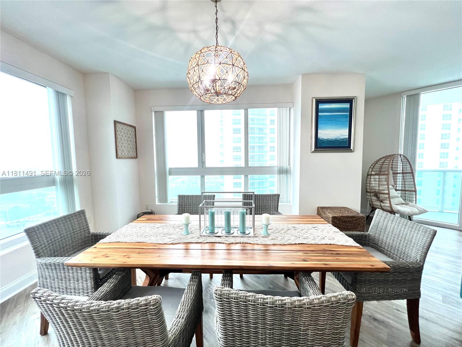 231 Riverside Drive, Unit 1210 Daytona Beach, FL 32117 - Photo 7 of 70 a view of a dining room with furniture window and outside view
