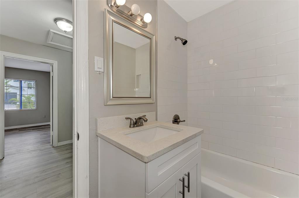 1891 Prospect Street Sarasota, FL 34239 - Photo 19 of 35 a bathroom with a sink and a mirror