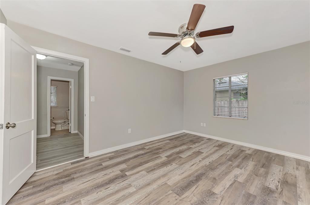 1891 Prospect Street Sarasota, FL 34239 - Photo 21 of 35 a view of empty room with wooden floor and ceiling fan