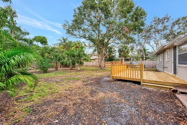a view of backyard with green space