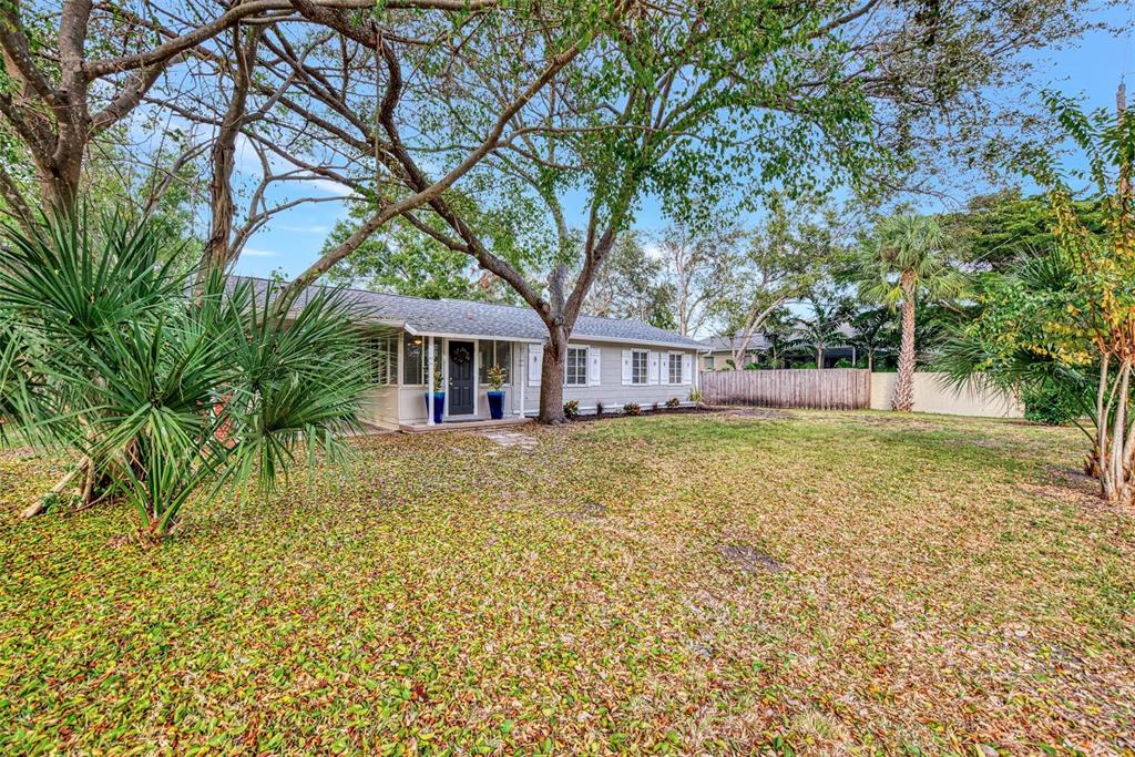 1891 Prospect Street Sarasota, FL 34239 - Photo 3 of 35 a front view of a house with a garden