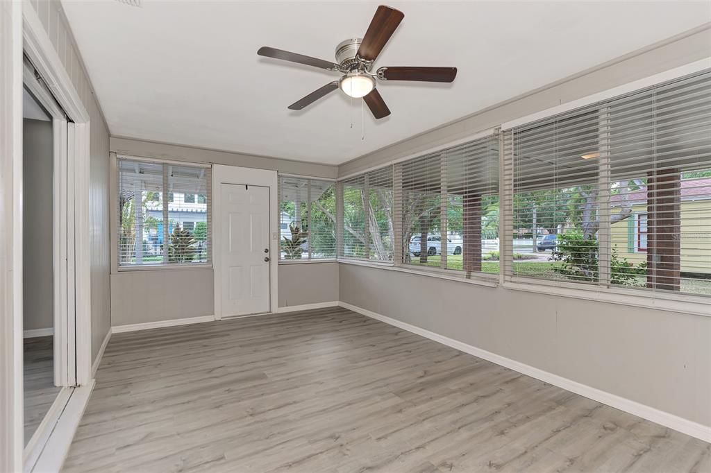 1891 Prospect Street Sarasota, FL 34239 - Photo 5 of 35 a view of an empty room with wooden floor and a window