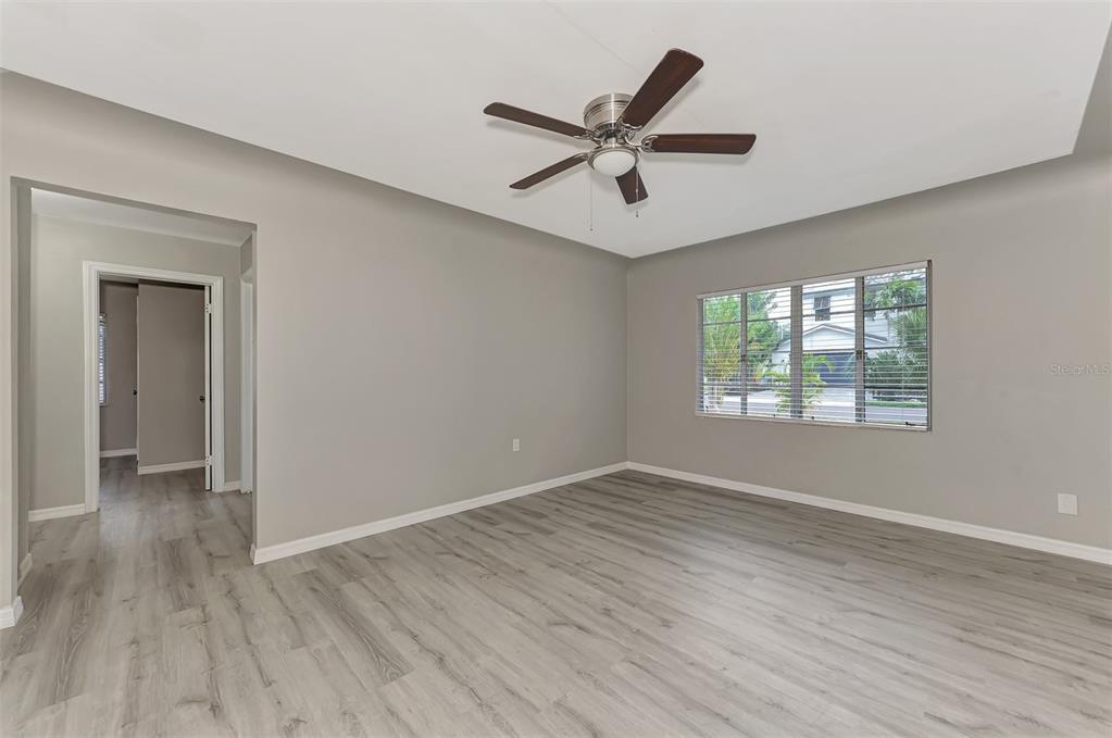 1891 Prospect Street Sarasota, FL 34239 - Photo 7 of 35 a view of a big room with wooden floor and windows