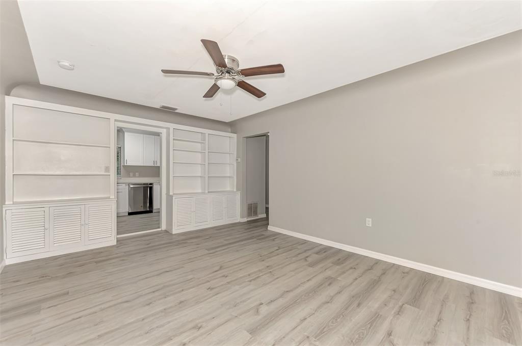 1891 Prospect Street Sarasota, FL 34239 - Photo 10 of 35 a view of an empty room with a window and wooden floor