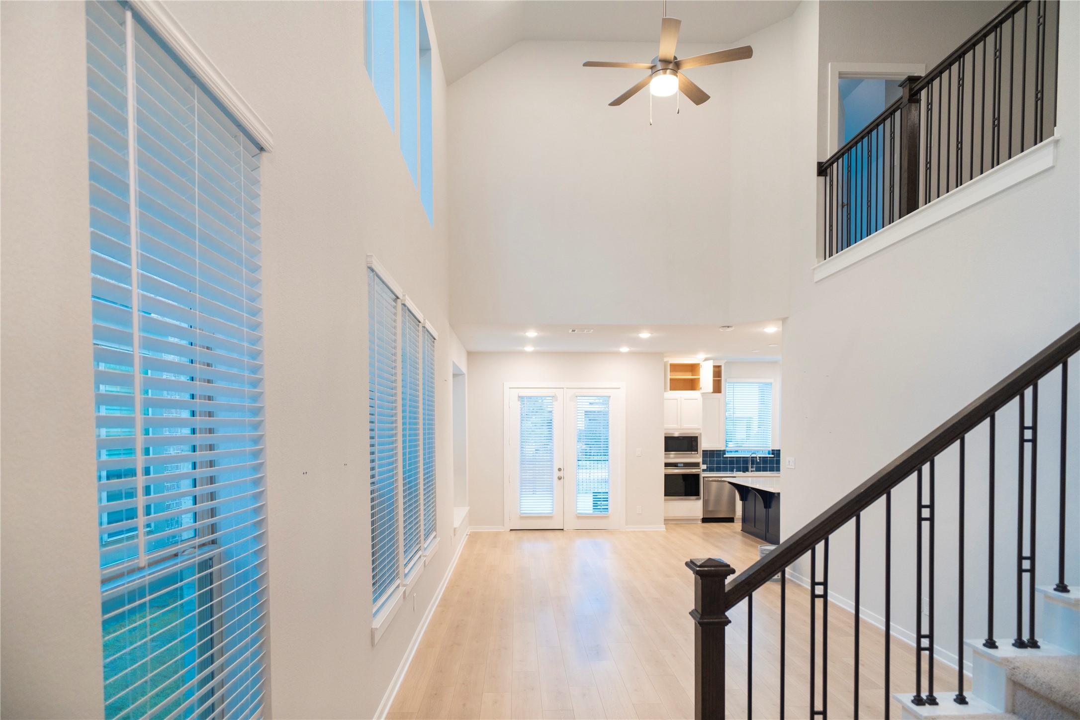 6519 Bramble Cv Lane Fulshear, TX 77441 - Photo 3 of 29 a view of a hallway with wooden floor and staircase