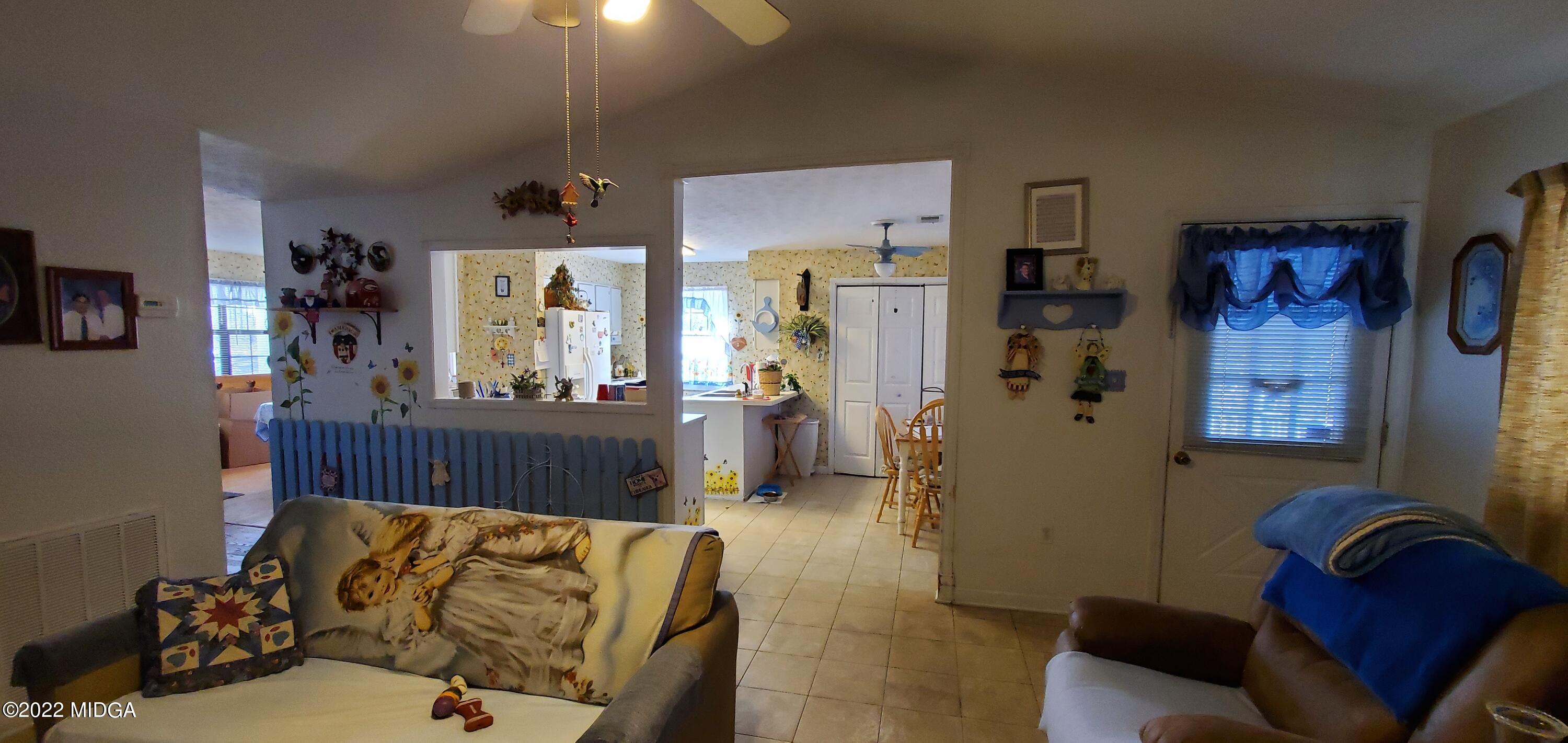5757 Rogers Road Lizella, GA 31052 - Photo 3 of 23 a living room with furniture and a couch