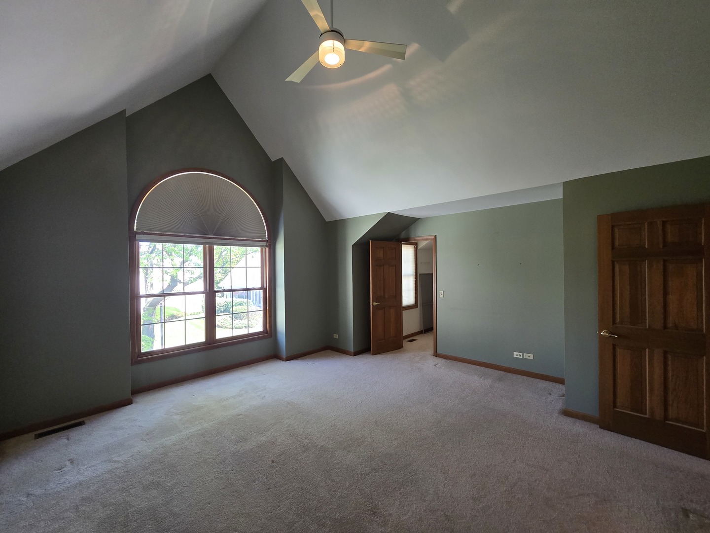 2286 Brookside Lane Aurora, IL 60502 - Photo 14 of 32 an empty room with chandelier fan and windows