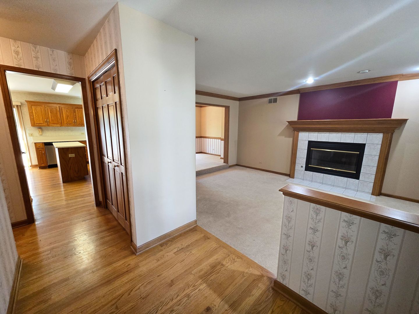 2286 Brookside Lane Aurora, IL 60502 - Photo 2 of 32 a view of a livingroom with wooden floor and a fireplace