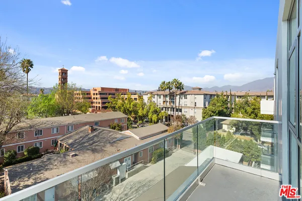 a view of a balcony with city view