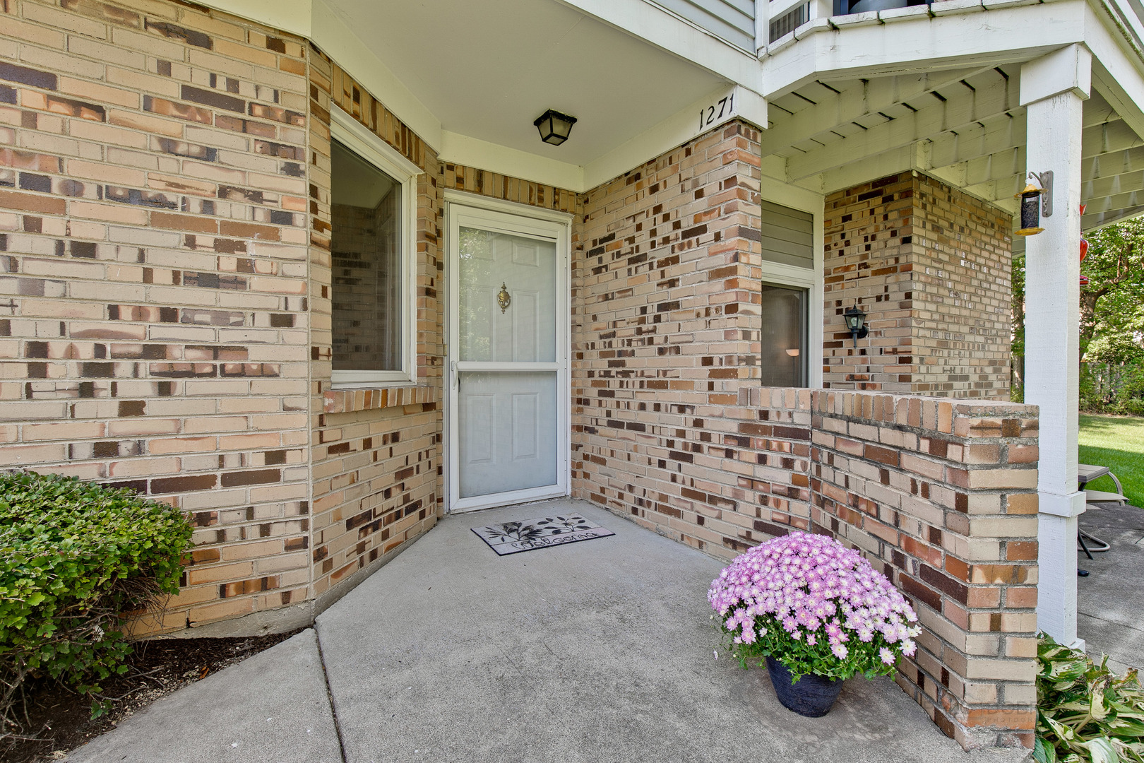 1271 Ranchview Court Buffalo Grove, IL 60089 - Photo 2 of 25 view of a brick wall with windows