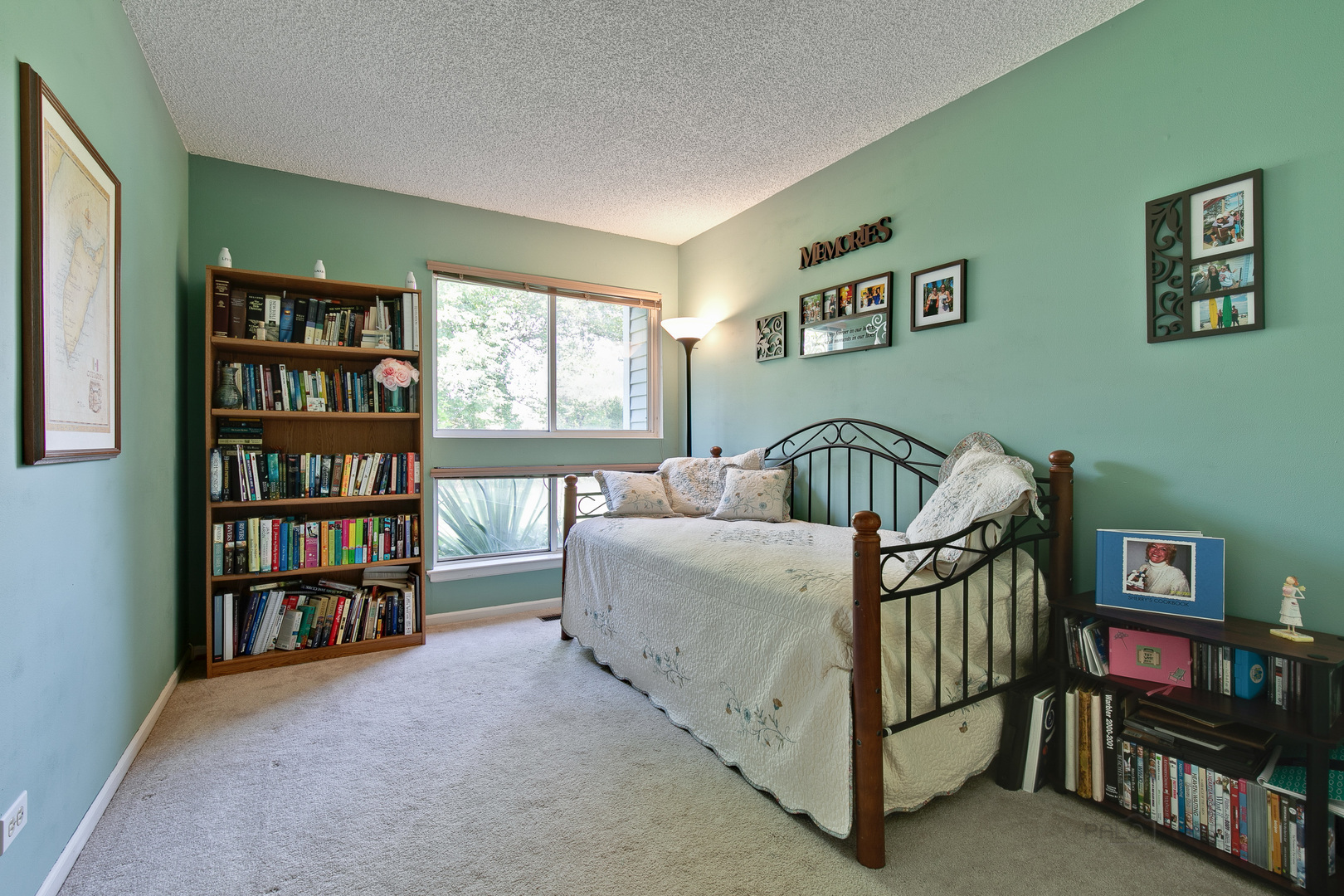 1271 Ranchview Court Buffalo Grove, IL 60089 - Photo 16 of 25 a bedroom with a bed and a book shelf