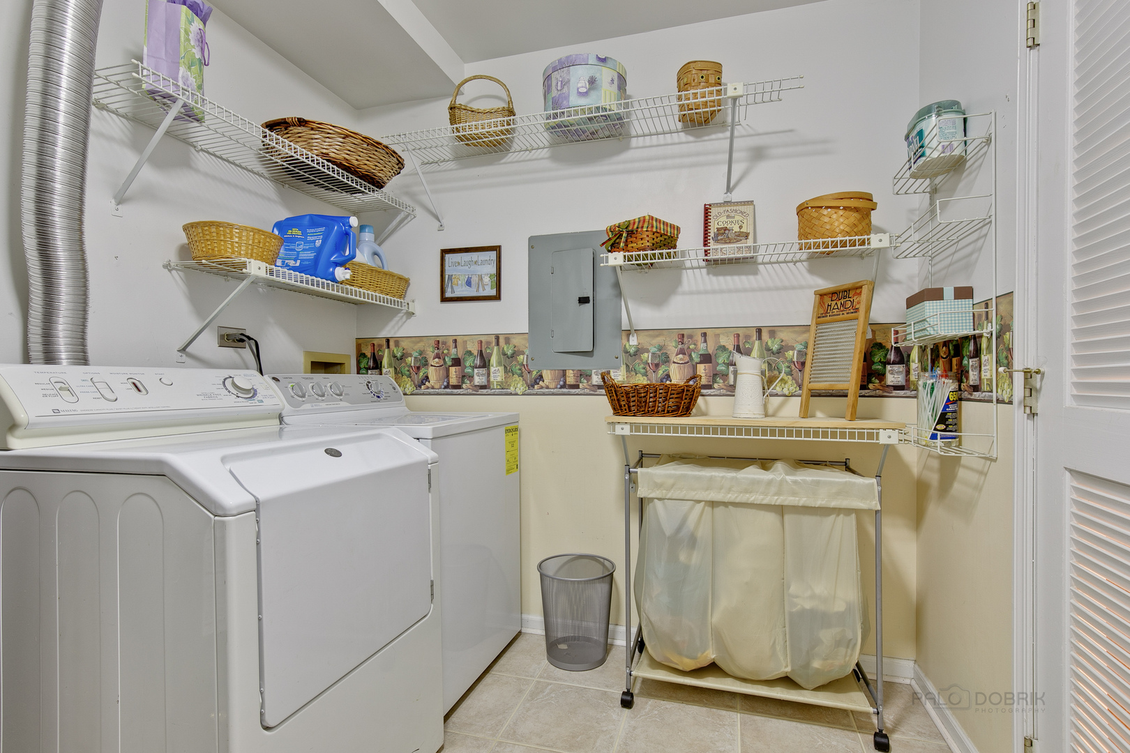 1271 Ranchview Court Buffalo Grove, IL 60089 - Photo 18 of 25 a utility room with cabinets washer and dryer