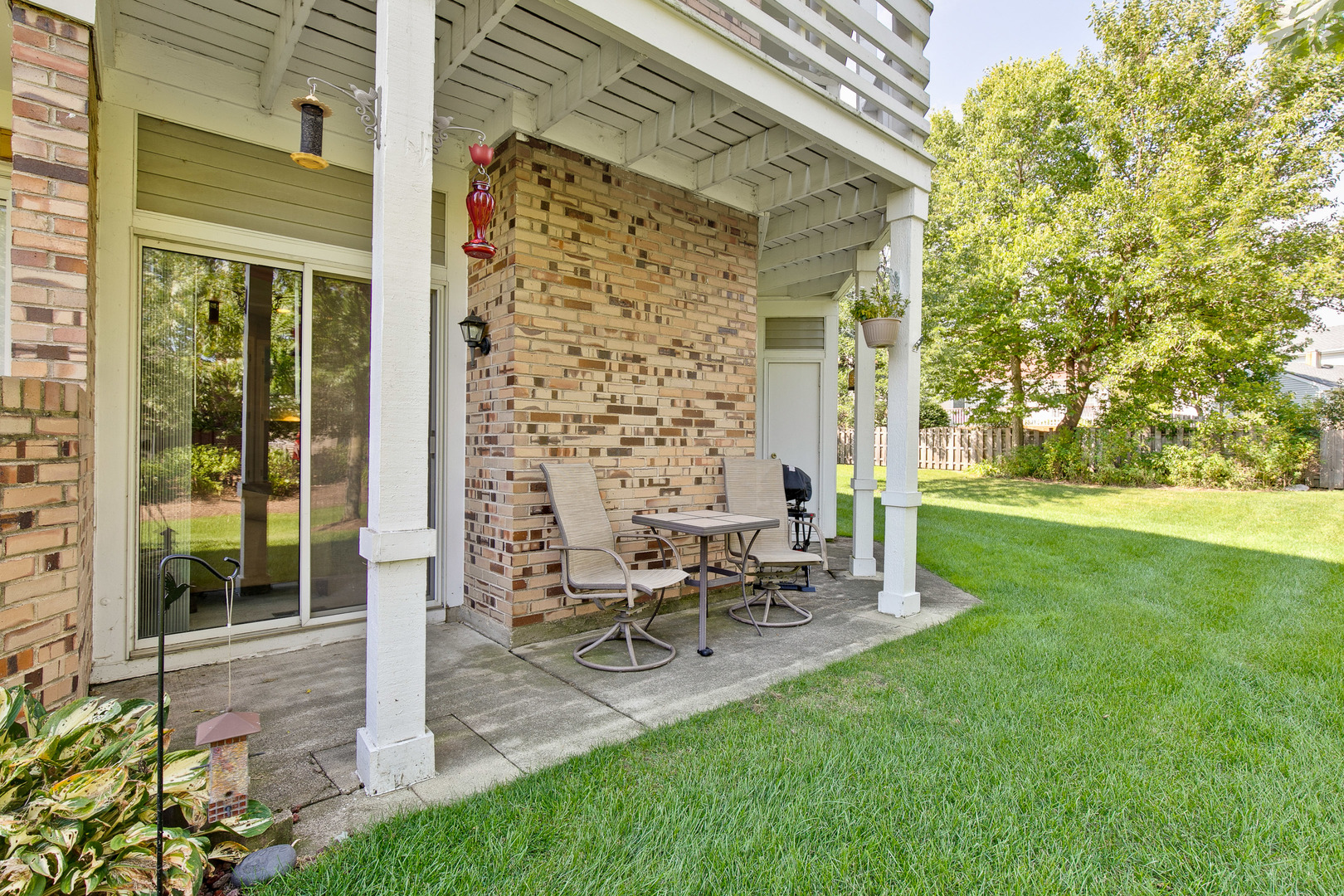 1271 Ranchview Court Buffalo Grove, IL 60089 - Photo 20 of 25 a view of backyard of house with outdoor seating and green space
