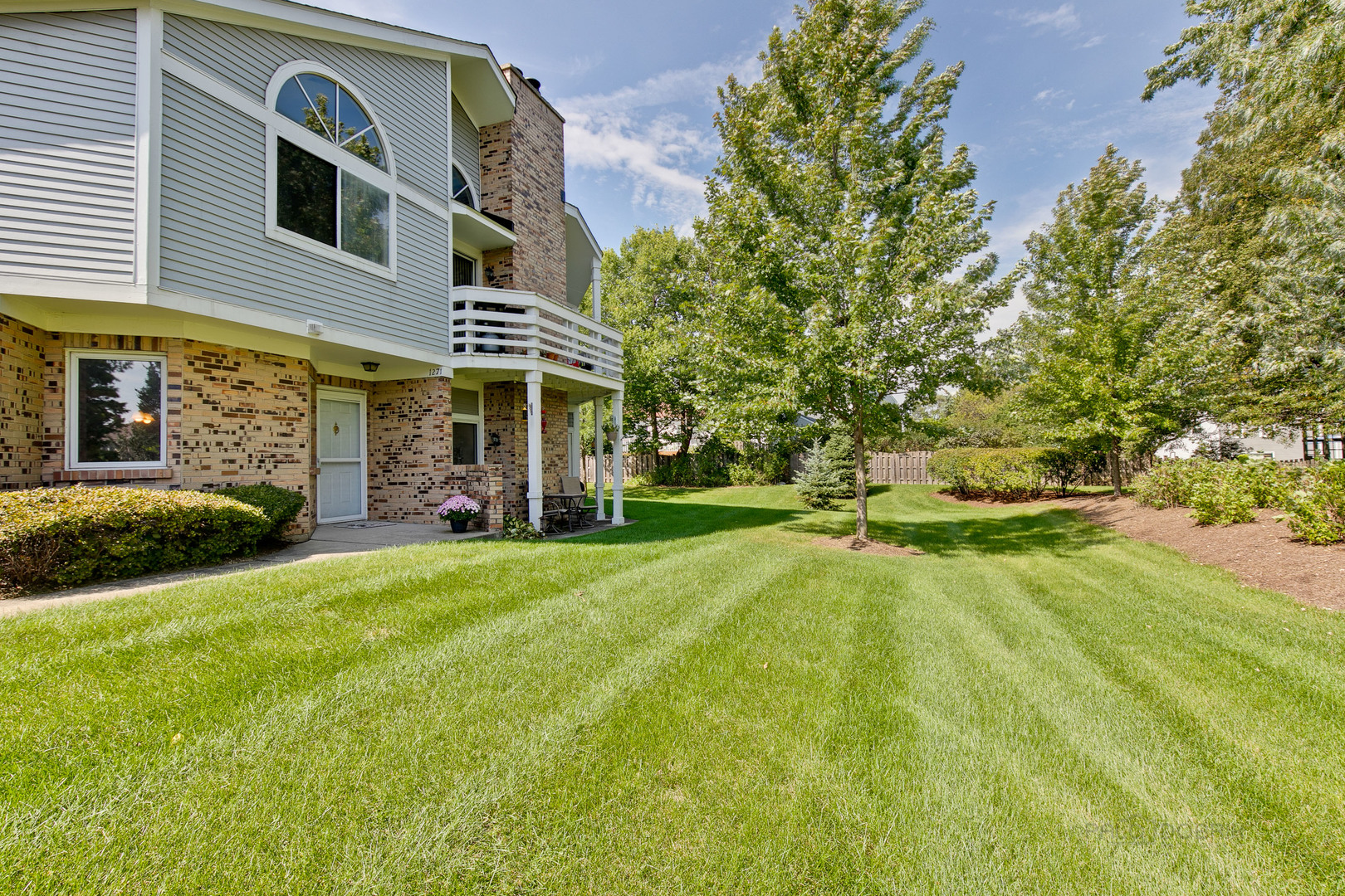 1271 Ranchview Court Buffalo Grove, IL 60089 - Photo 22 of 25 a front view of a house with a yard