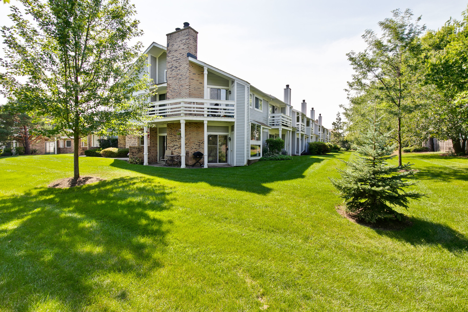 1271 Ranchview Court Buffalo Grove, IL 60089 - Photo 25 of 25 a view of a house with a big yard and large trees