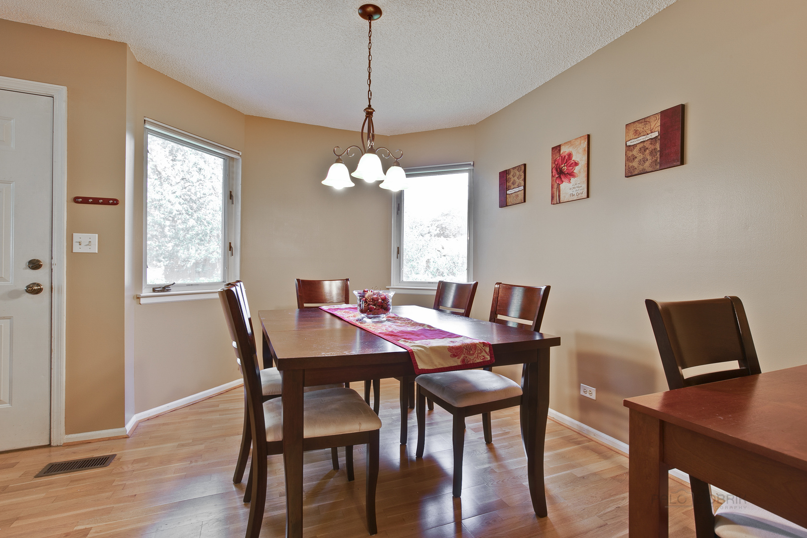 1271 Ranchview Court Buffalo Grove, IL 60089 - Photo 5 of 25 a view of a dining room with furniture window and wooden floor