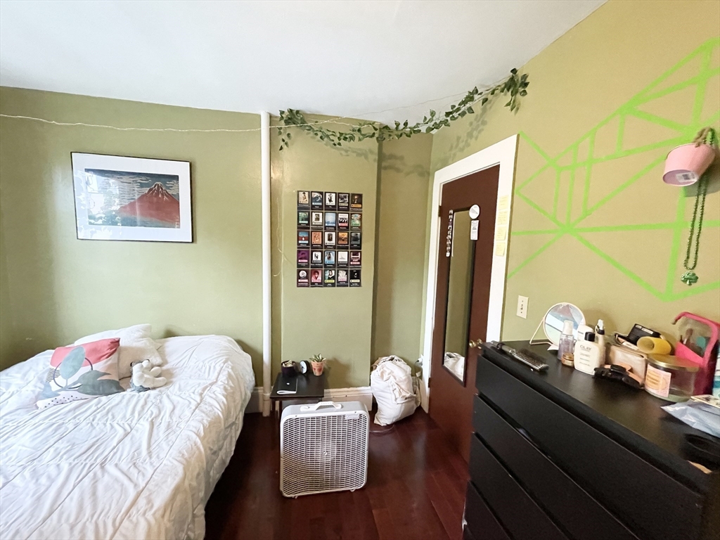 74 Hammond Street, Unit 2 Boston, MA 02120 - Photo 5 of 10 a bedroom with a bed and a window