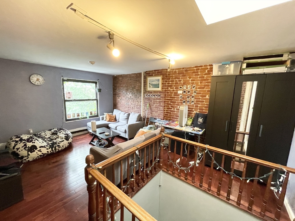 74 Hammond Street, Unit 2 Boston, MA 02120 - Photo 6 of 10 a view of a living room and dining room