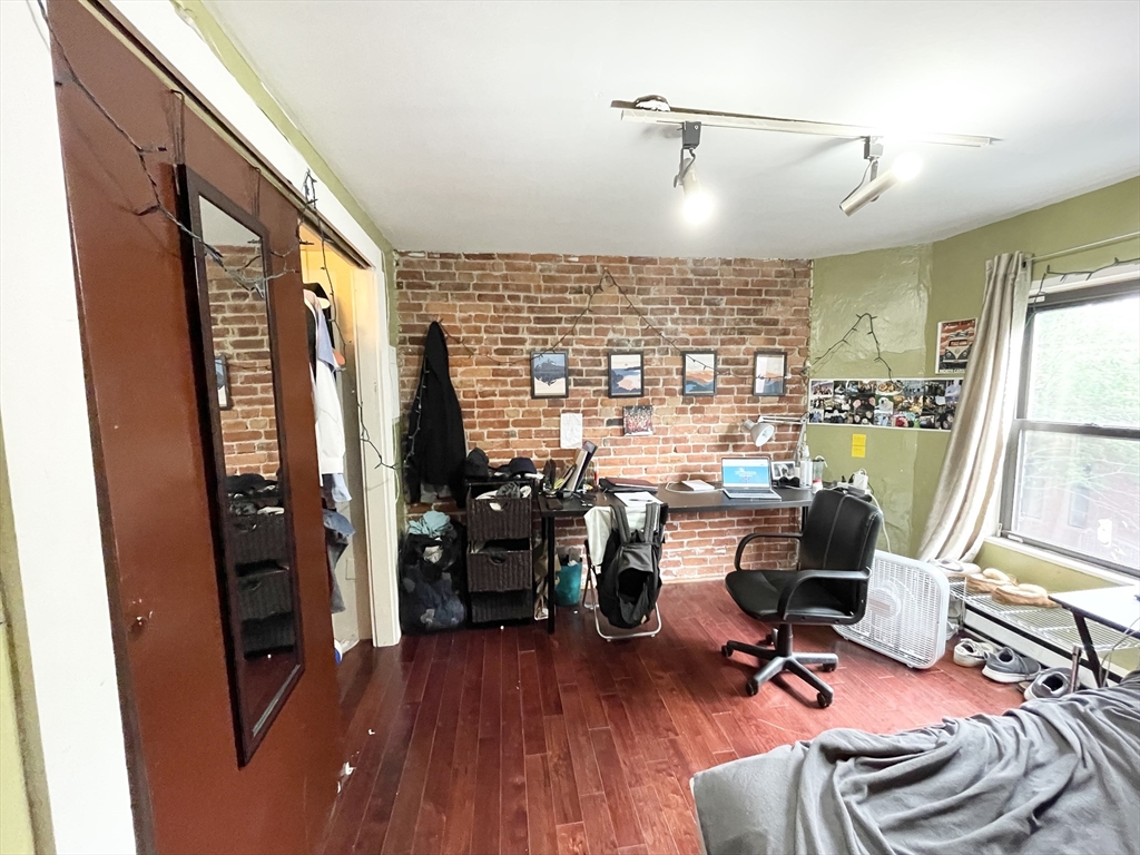 74 Hammond Street, Unit 2 Boston, MA 02120 - Photo 10 of 10 a view of a livingroom with workspace and a window