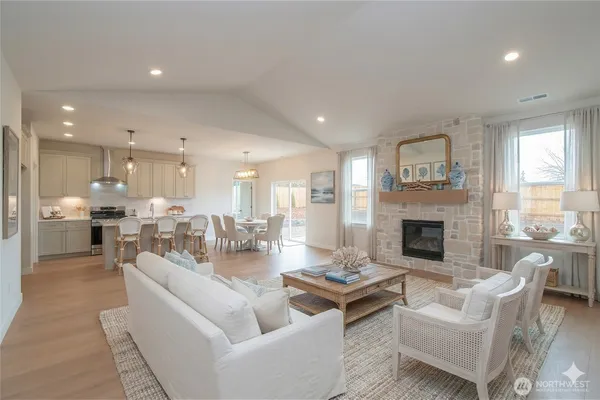 a living room with fireplace furniture and a fireplace