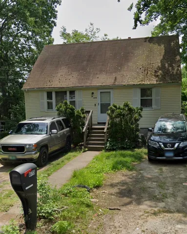 a car parked in front of a house