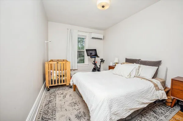 a bed room with a bed and a chair