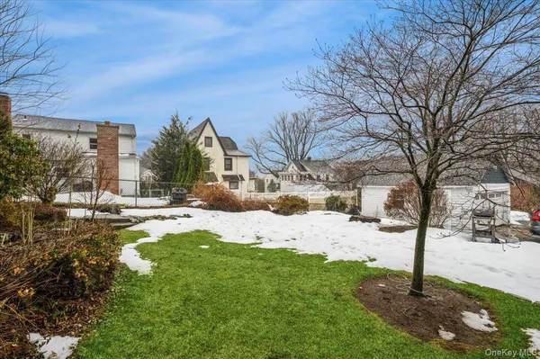 a front view of a building with a yard