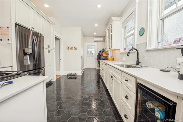 a bathroom with a sink a mirror and a bathtub