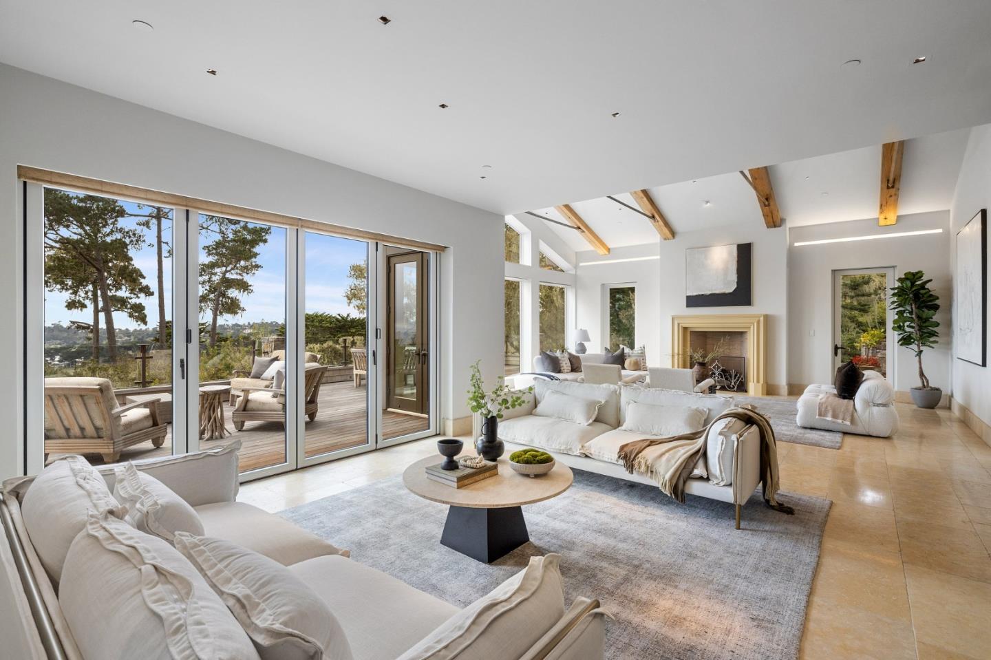 3204 Palmero Way Pebble Beach, CA 93953 - Photo 23 of 93 a living room with furniture large windows and a fireplace