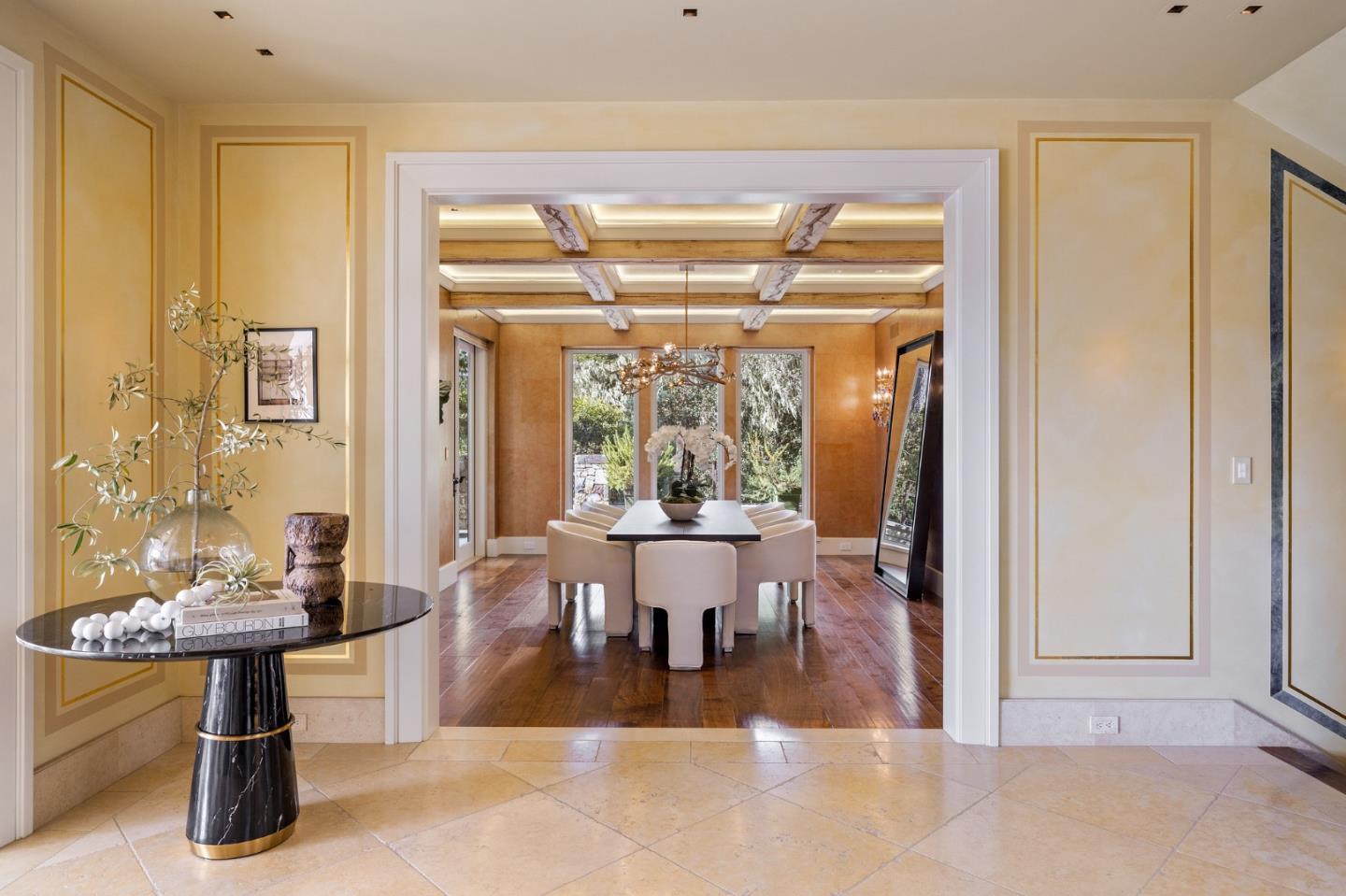 3204 Palmero Way Pebble Beach, CA 93953 - Photo 25 of 93 a view of a dining room with furniture wooden floor and a chandelier
