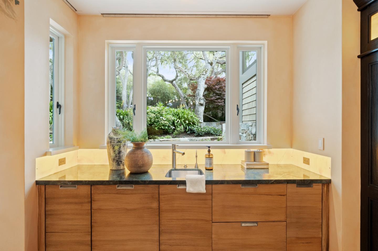 3204 Palmero Way Pebble Beach, CA 93953 - Photo 37 of 93 a bathroom with a granite countertop sink and a large mirror